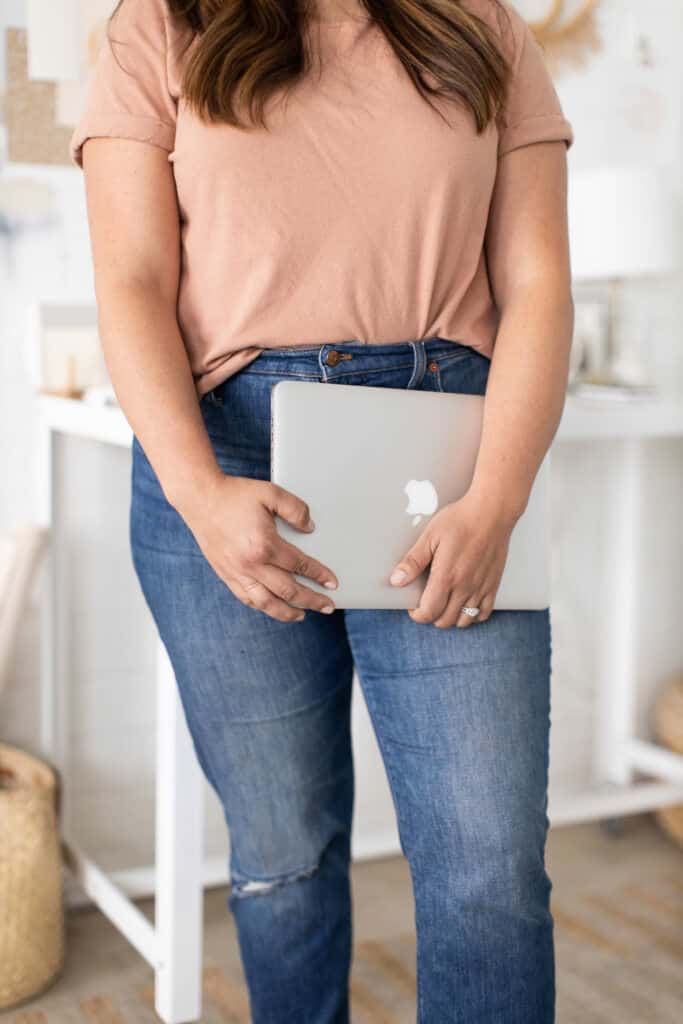 woman holding laptop